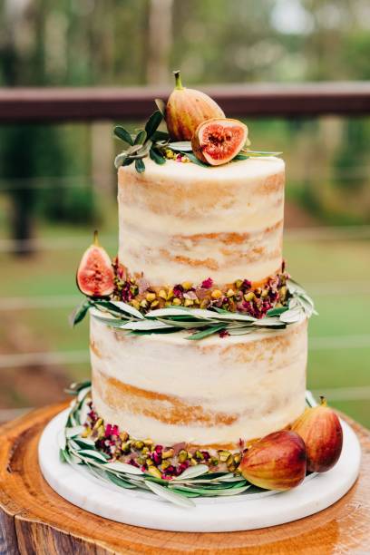 istock Vertical selective closeup shot of a cake decorated with figs and nuts 1440024582