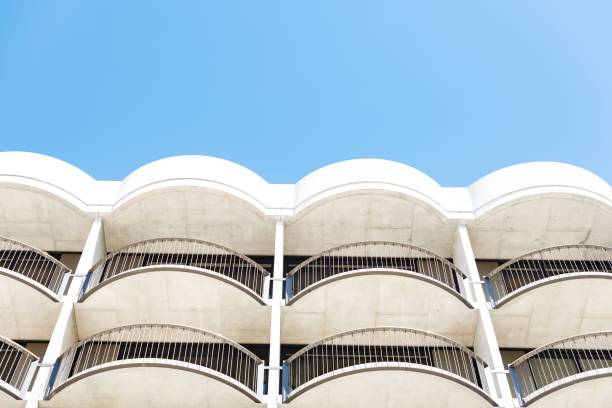 istock Low angle shot of white architectural building with balconies 1440024592
