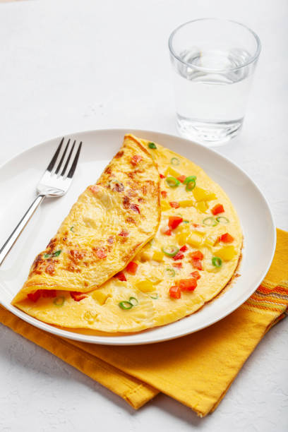 istock omelette with tomato, bell pepper onion and cheese. healthy breakfast 1440024598