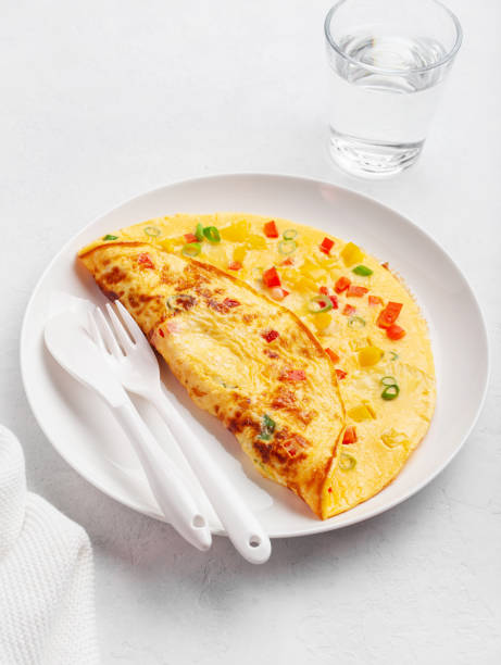 istock omelette with tomato, bell pepper onion and cheese. healthy breakfast 1440024744