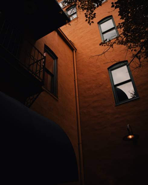 istock Low angle shot of a brown building with vertical windows 1440025797