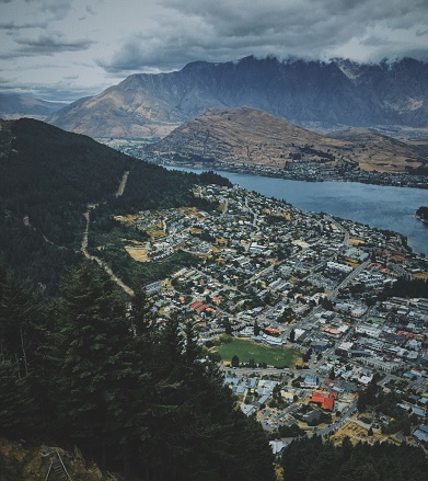 An aerial shot of the beautiful Queenstown near the lake with mountains in the background