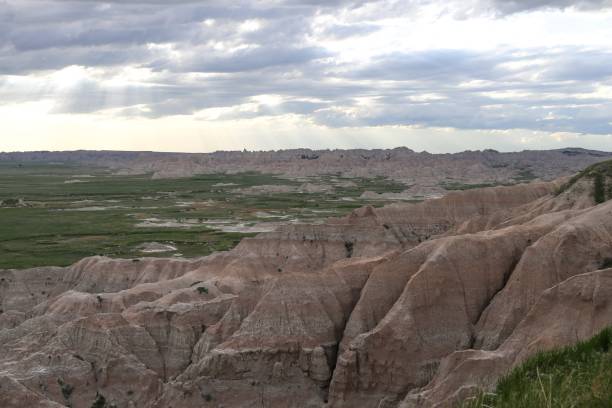 istock Beautiful shot of badlands with grassy fields 1440026694