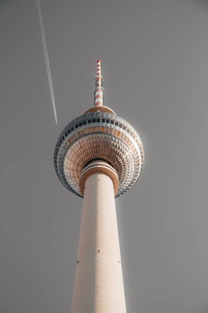 istock Low angle shot of a beautiful tall white tower in Berlin called Alexanderplatz with a grey sky 1440027472