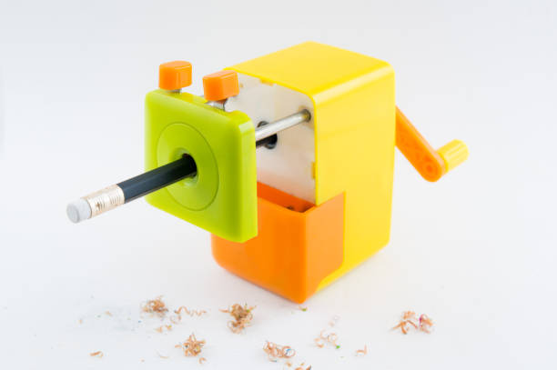 colorful rotary pencil sharpener with pencil, on white background