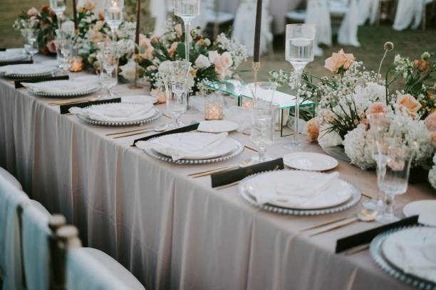 istock Decorated table setting with a floral design for a wedding celebration during daytime 1440030199