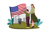 istock The boy and mother visit the grave of his father who is a veteran 1440030992