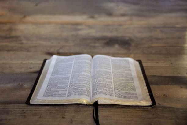 istock High angle shot of an open book on a wooden surface 1440031108