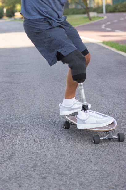 istock Close-up of man riding longboard 1440031610