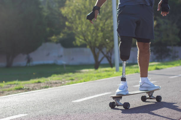 istock Close-up of man riding longboard in sunlight 1440031617