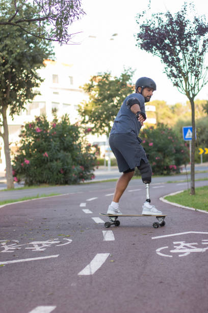istock Cool person with disability doing sports in park 1440031690