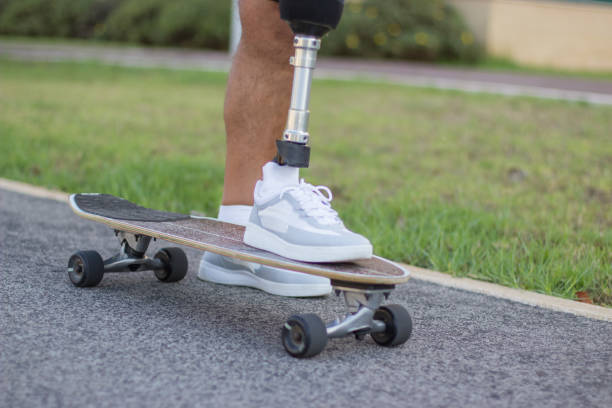 istock Man in new white sneakers standing on skateboard 1440031730