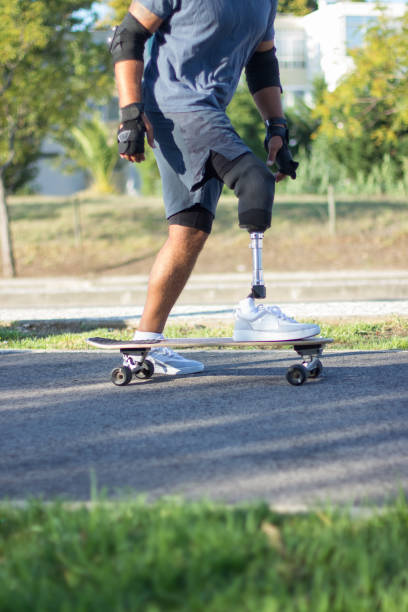 istock Side view of skater with prosthetic leg 1440031841