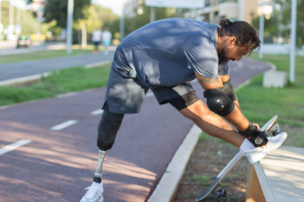 istock Sportsman with prosthetic leg getting ready for training 1440031877