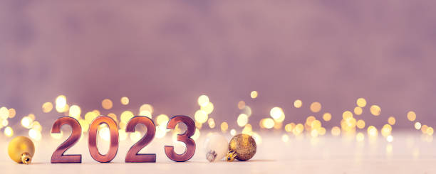 istock Metal numbers 2023 on table with bokeh lights. 1440031968