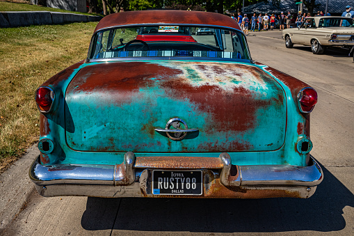 Des Moines, IA - July 02, 2022: High perspective rear view of a 1955 Oldsmobile Holiday 88 2 Door Hardtop at a local car show.