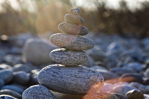 A closeup shot of rocks balancing on each other with a blurred background