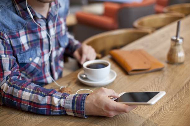 istock Close shot of a male using his smartphone with a blurred background 1440032739