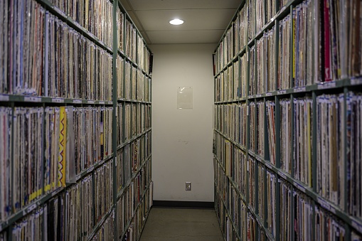 A large collection of vinyl and cassettes at a radio station storage