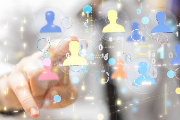 istock Man touching 3D rendered people icons with his two fingers 1440033497