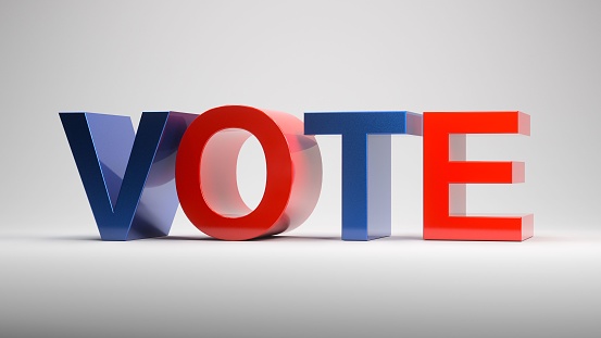 A digital 3D render of red and blue letters spelling out VOTE on a gray background