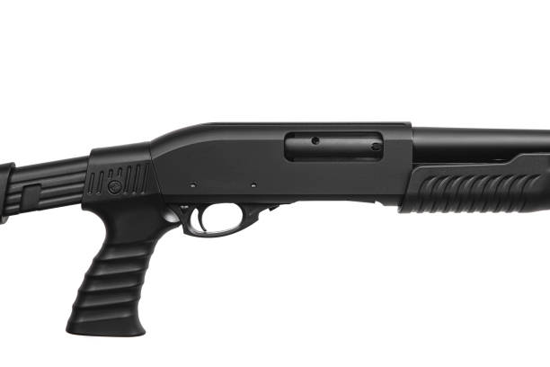 istock Pump-action 12 gauge shotgun isolated on a white background. A smooth-bore weapon with a plastic stock. 1440033746