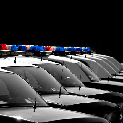 Row of Police Cars with Blue and Red Lights for public safety and emergencies