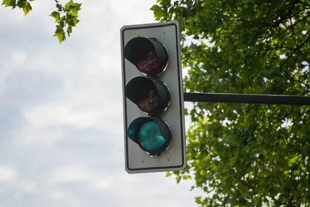 istock Traffic light on the street, close-up, vertical 1440034712