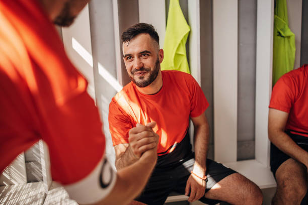 istock Soccer players in locker room 1440035164