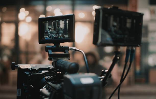 istock Selective shot of a black camera on a tripod 1440036455
