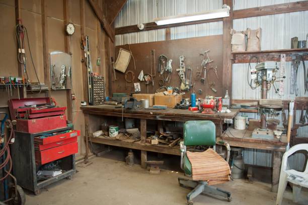 istock Wide shot of an old barn' s workbench with different types of tools 1440036814