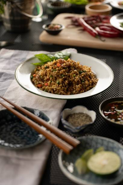 istock Vertical shot of a dish with rice and vegetables with a blurred background 1440037146