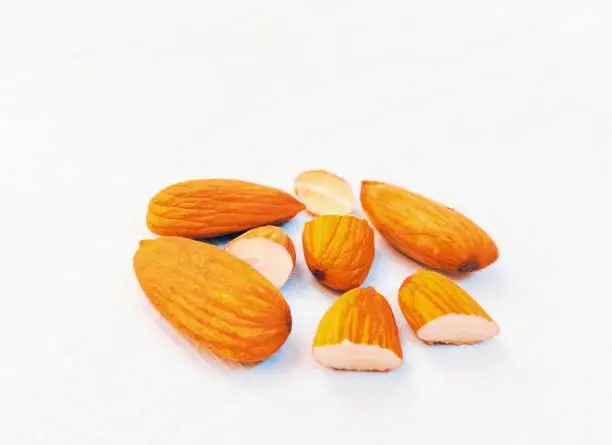 Almonds nuts food Badam sweet almond nut  Lauz  amendoa badem  mandle  orechor amandel almendra, manteli amande mandorla Badem qua hanh Prunus dulcis closeup view image stock photo