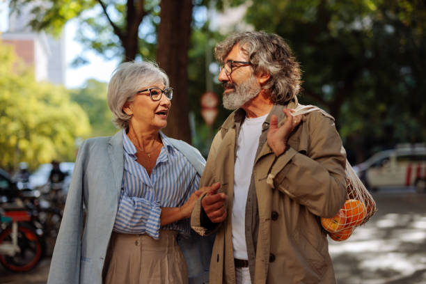 istock Senior couple take walk in city. 1440039279