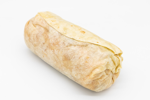 A closeup of a simple large burrito on a white background