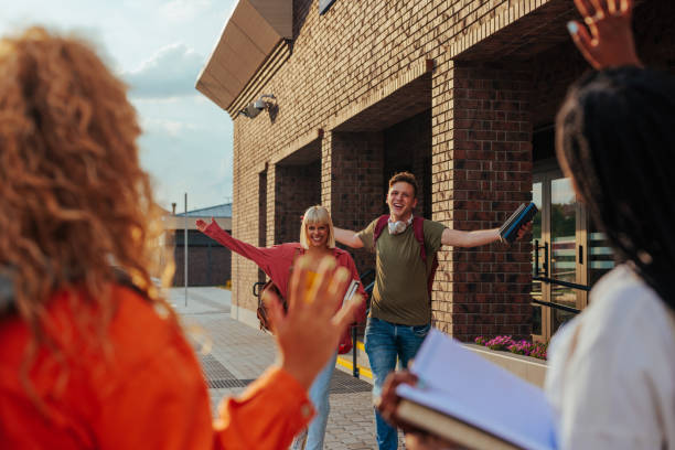 istock Happy friends meet at school. 1440040451