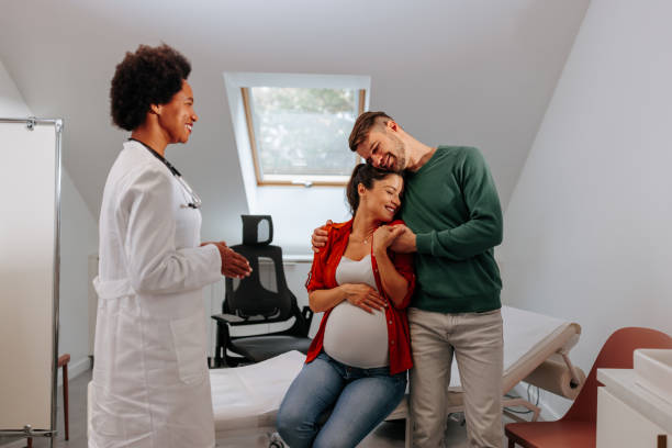 istock Young parents to be at doctors office. 1440040731