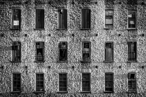 Apartment windows from brick facade of a building in New York City.