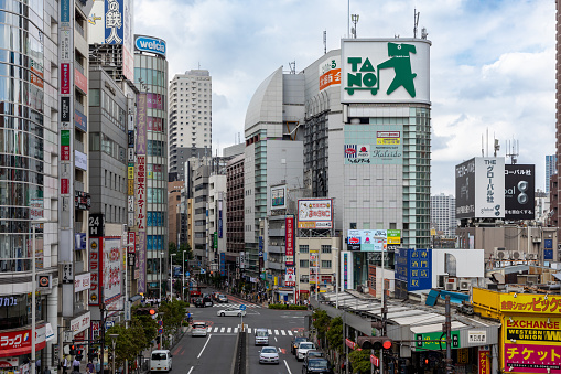 Tokyo, Japan - September 4, 2022 : Shinjuku street scene in Tokyo, Japan. Shinjuku is a major commercial and entertainment district in Tokyo.