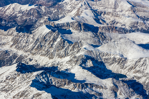 Aerial view of Rocky Mountains covered by snow