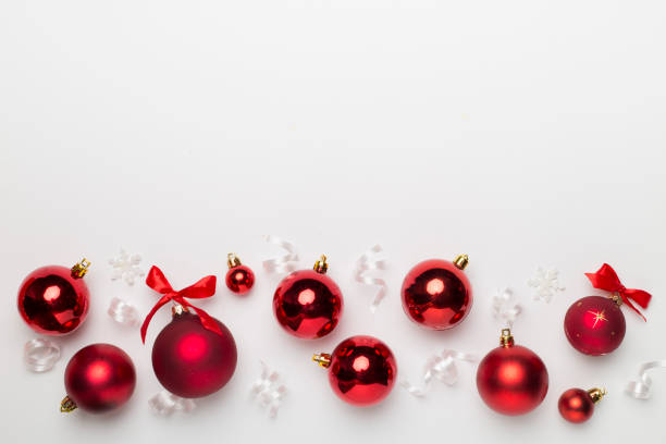 istock Christmas ball toys and confetti on white background, top view 1440051185