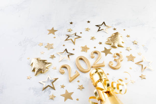 holiday background with golden christmas decorations and new year 2023 numbers and confetti stars. - confetti new years day new year christmas imagens e fotografias de stock