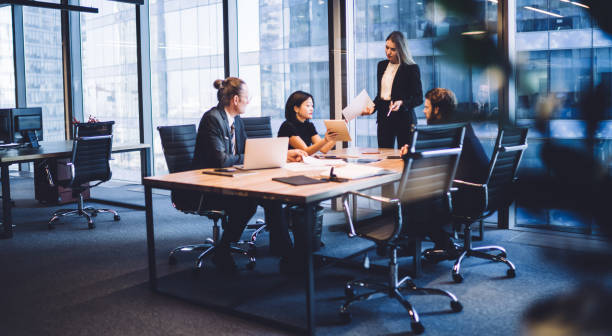 Determined business people talking about marketing strategy in modern workplace