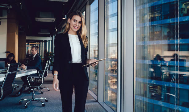 istock Delighted businesswoman using tablet in office 1440053378
