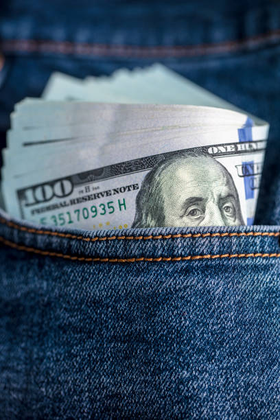 istock Dollar bills in jeans pocket 1440053384