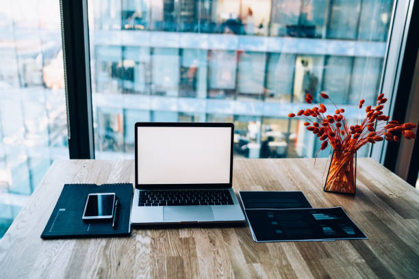 istock Laptop and smartphone on office desk in modern workplace 1440054059