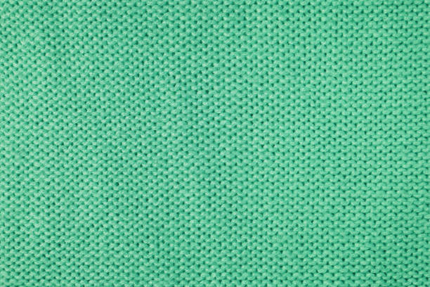istock Bright green knitwear wool fabric texture background. Abstract textile backdrop 1440054177