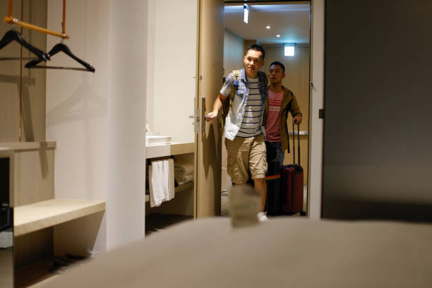 istock Two men travel to hotel and check in 1440057553