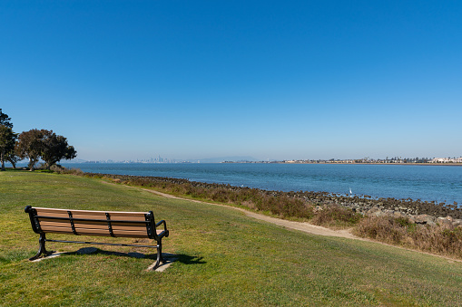 Looking west from Alameda across the blue water of San Francisco Bay to the city of San Francisco, California.