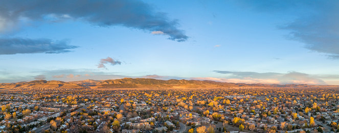 November sunrise over Fort Collins and foothills of Rocky Mountains in northern Colorado, aerial panorama